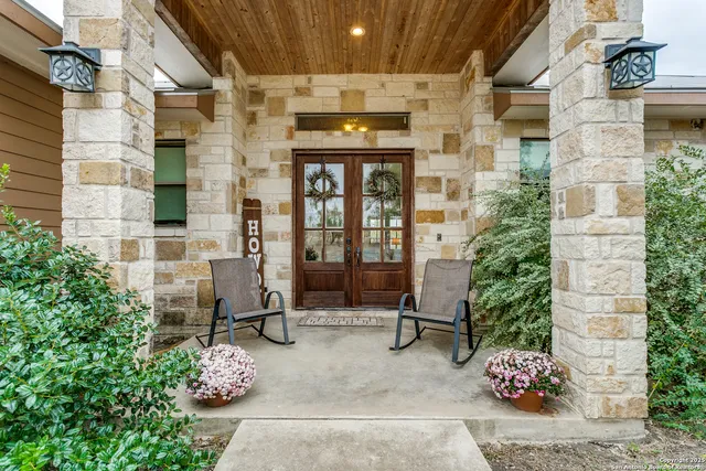 a front view of a building with outdoor seating space