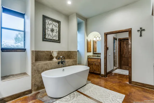 a bathroom with a bathtub and a sink