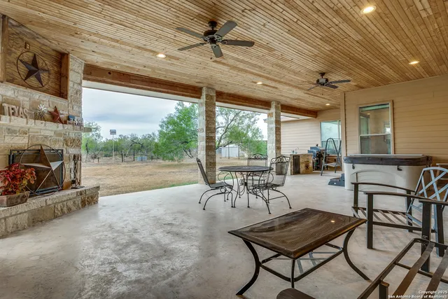a outdoor space with lots of chairs and a table