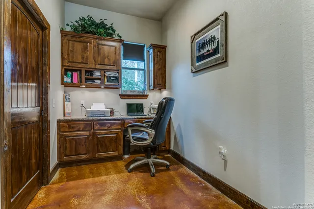 a view of a workspace with furniture