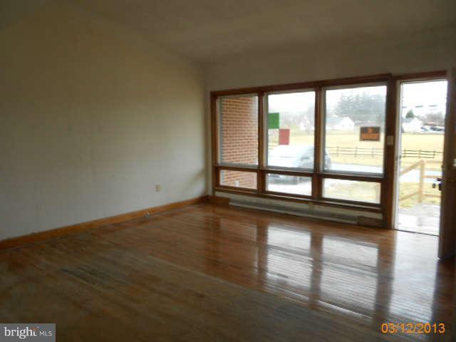 1555 Fairmount Road Hampstead, MD 21074 - Photo 6 of 23 a view of a room with large windows