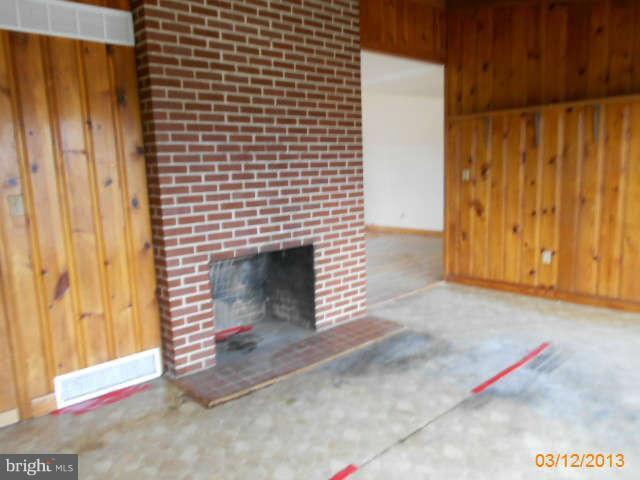 1555 Fairmount Road Hampstead, MD 21074 - Photo 7 of 23 a view of empty room with fireplace