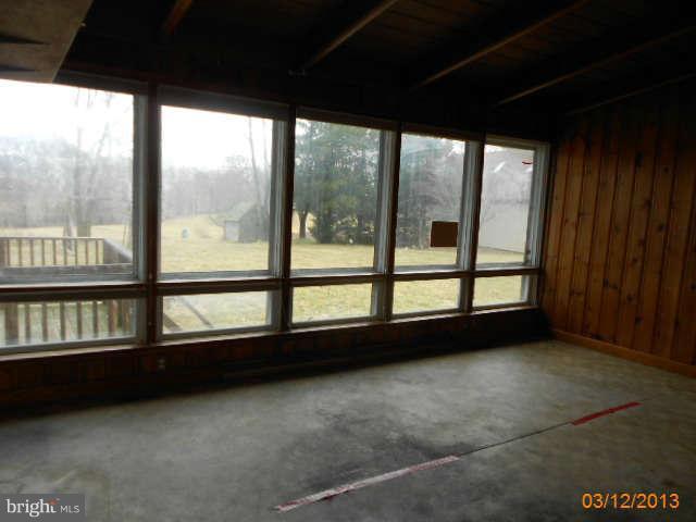 1555 Fairmount Road Hampstead, MD 21074 - Photo 8 of 23 a view of an empty room with a large window