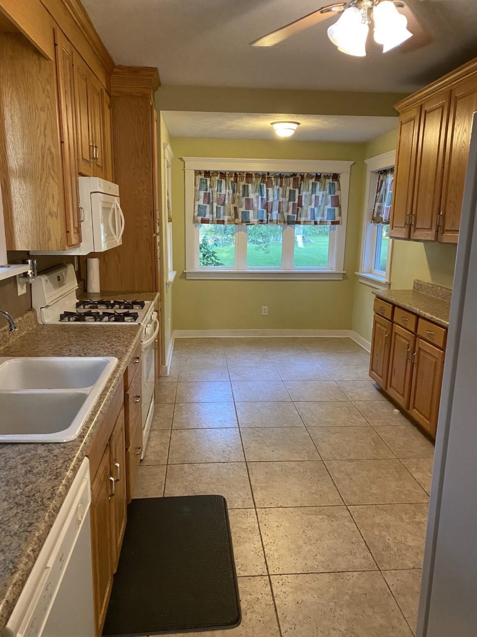 6565 Graden Prairie Rd Garden Prairie Garden Prairie, IL 61038 - Photo 6 of 19 a kitchen with stainless steel appliances granite countertop a sink stove and cabinets