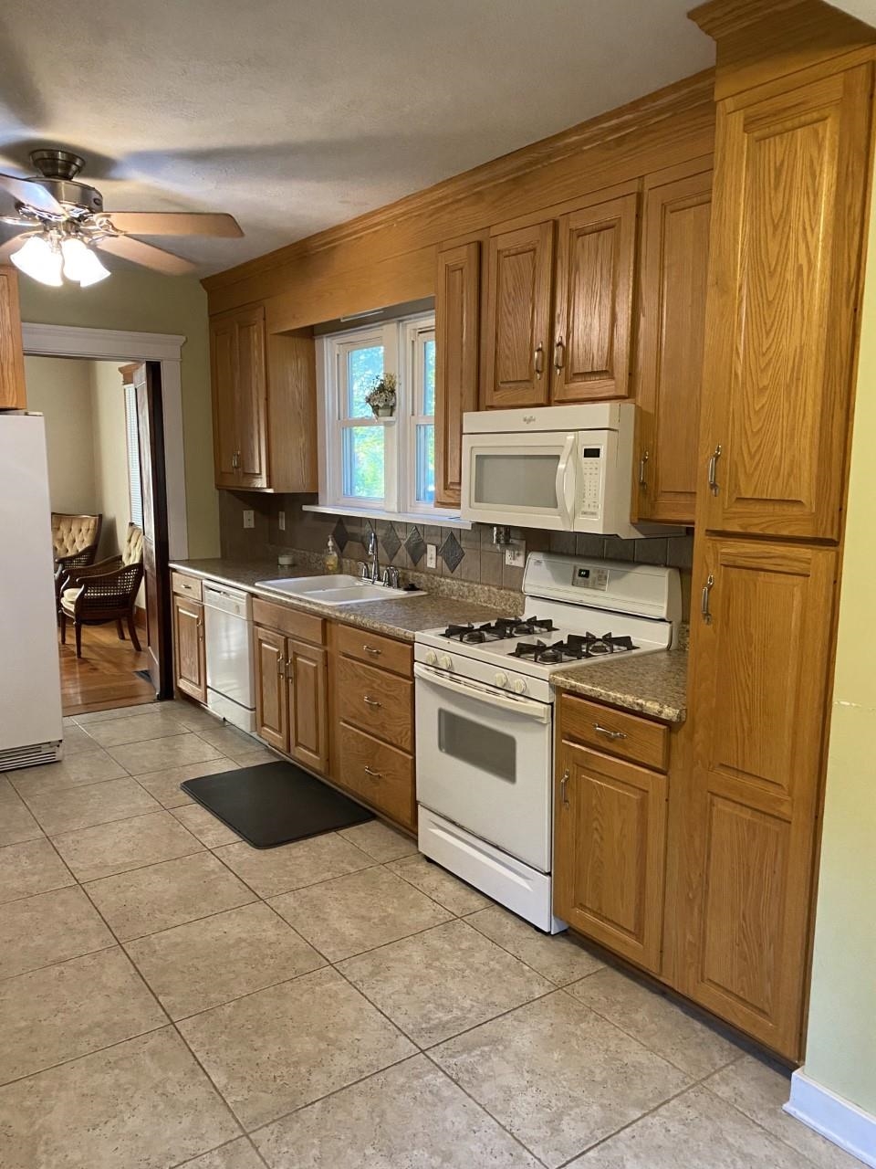6565 Graden Prairie Rd Garden Prairie Garden Prairie, IL 61038 - Photo 8 of 19 a kitchen with stainless steel appliances granite countertop a stove a sink and a refrigerator