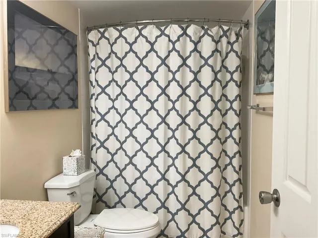 a view of a house with swimming pool and sitting area