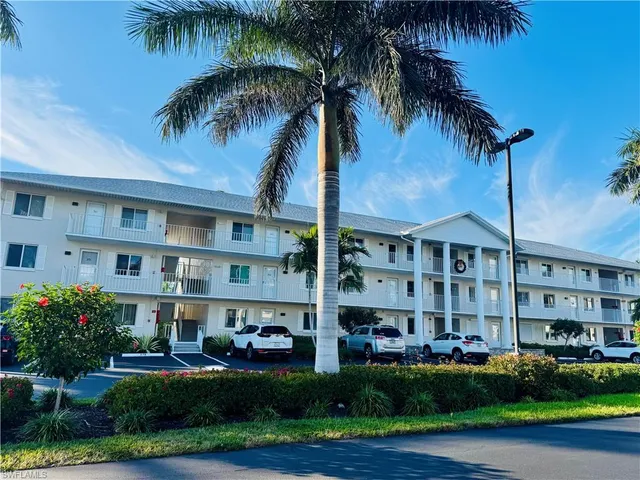 a kitchen with stainless steel appliances granite countertop a stove microwave and sink