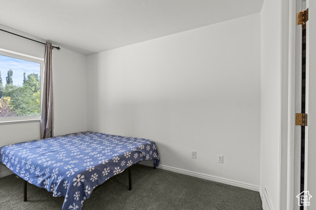 1099 Three Point Avenue Logan, UT 84321 - Photo 10 of 27 Carpeted bedroom featuring baseboards