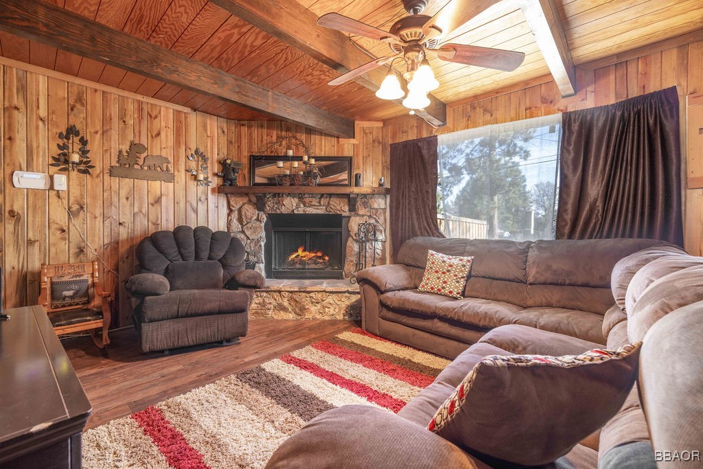 548 Riverside Avenue Sugarloaf, CA 92386 - Photo 11 of 37 a living room with furniture a fireplace and a large window