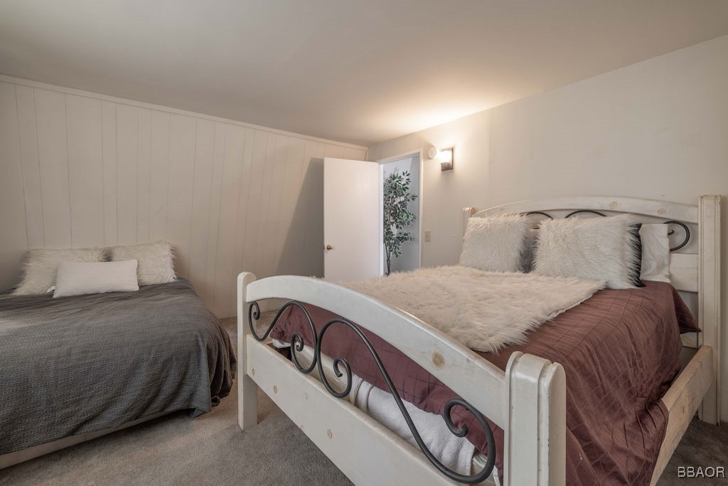 548 Riverside Avenue Sugarloaf, CA 92386 - Photo 25 of 37 a bedroom with a bed and window