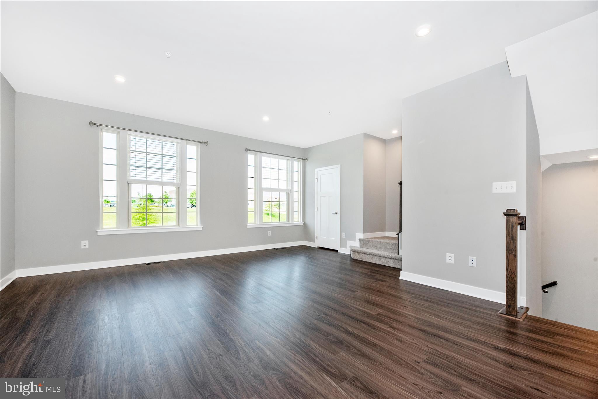 7091 Kokanee Way New Market, MD 21774 - Photo 9 of 69 an empty room with wooden floor and windows