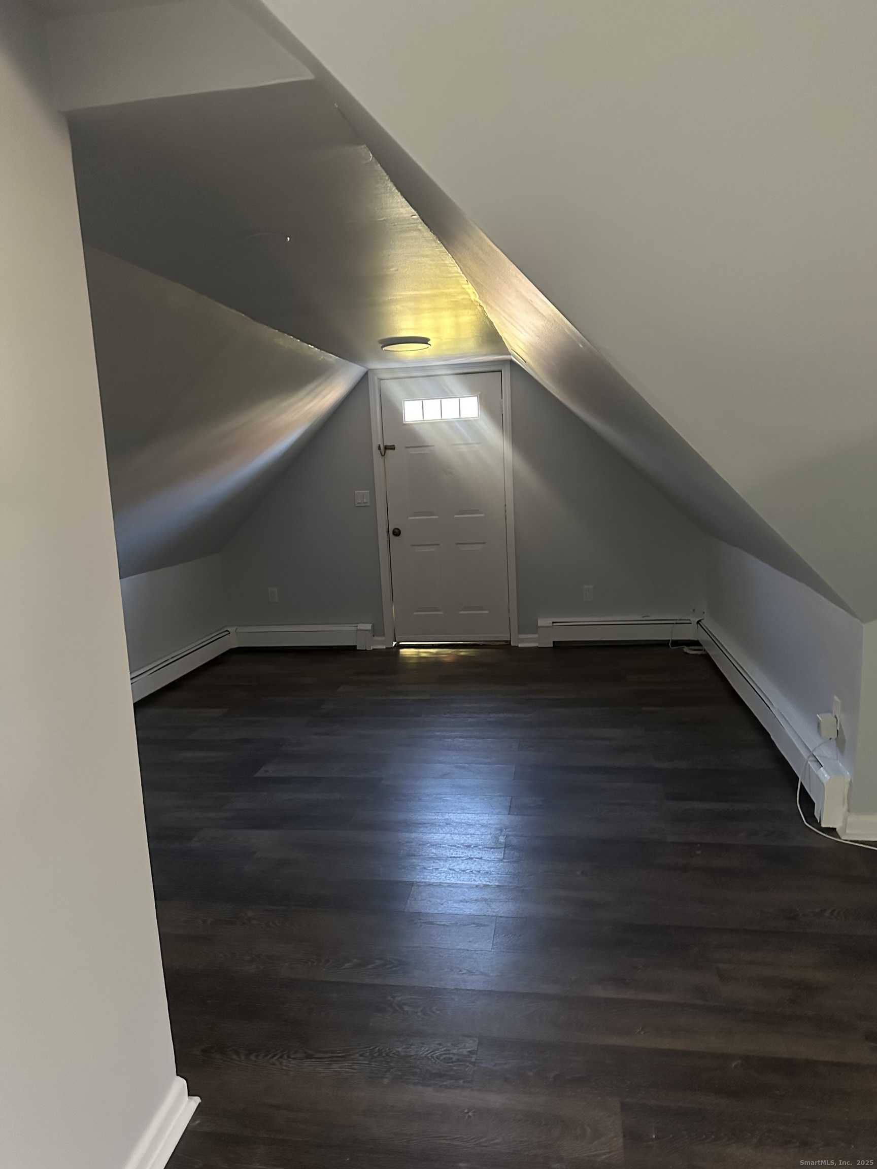 75 Broad Street, Unit 2 Norwalk, CT 06850 - Photo 2 of 10 a view of room and hardwood floor