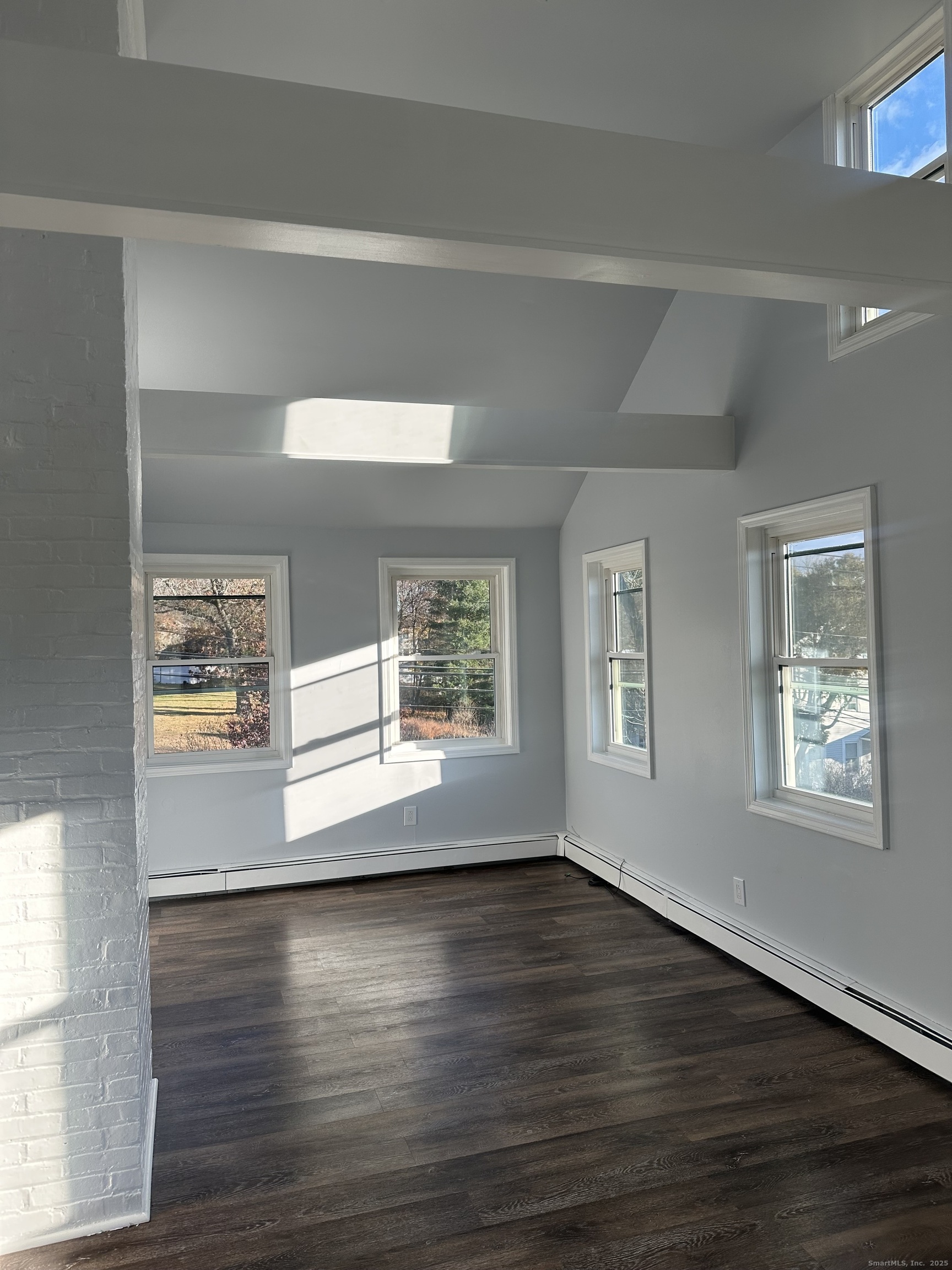 75 Broad Street, Unit 2 Norwalk, CT 06850 - Photo 7 of 10 a view of empty room with wooden floor and fan