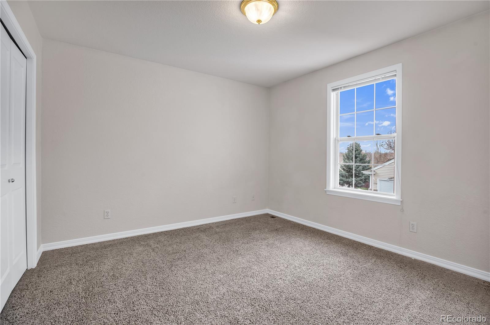 11690 West 46th Avenue Wheat Ridge, CO 80033 - Photo 16 of 33 a view of a window in an empty room