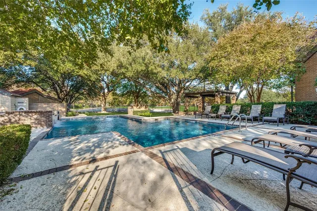 a view of a park with large trees