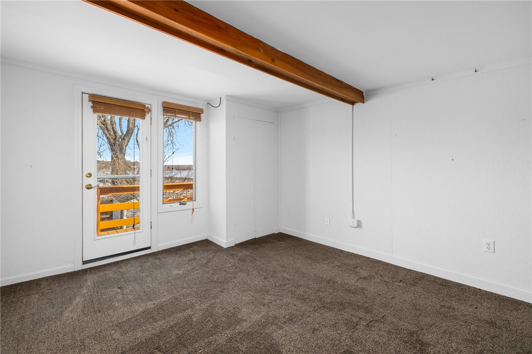 47 Point Road Portsmouth, RI 02871 - Photo 19 of 23 loft bedroom over den with balacony overlooking yard and water
