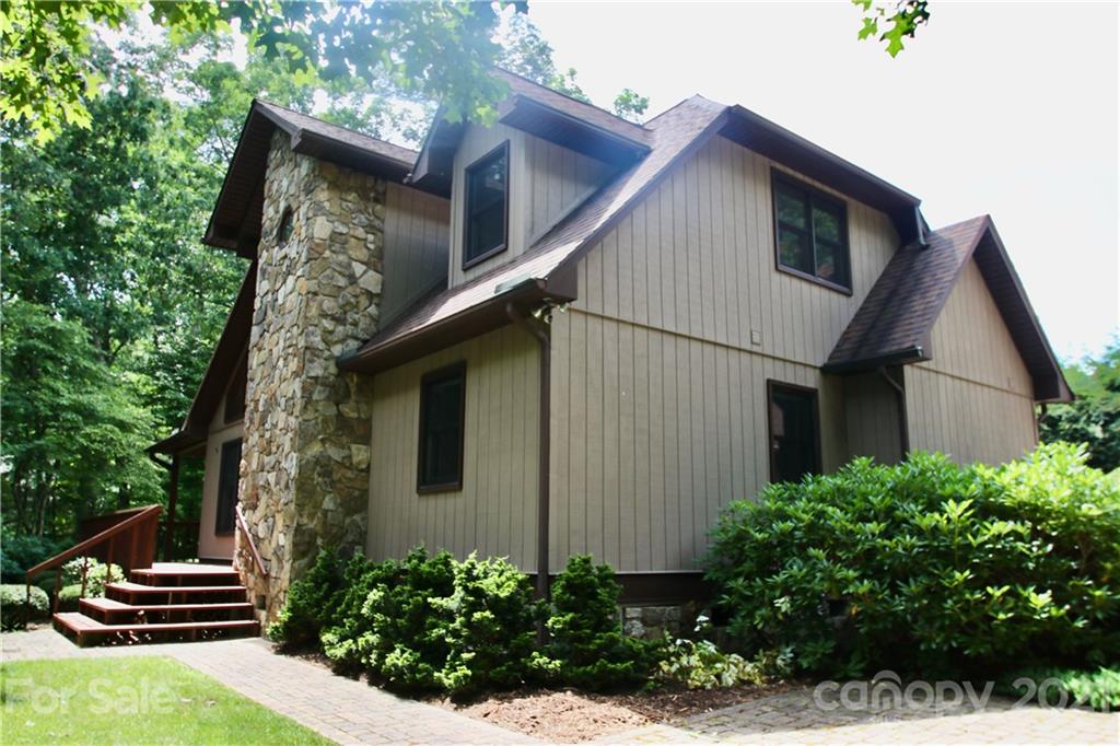 304 Oak Ridge Drive Clyde, NC 28721 - Photo 1 of 31 a view of house with backyard and trees