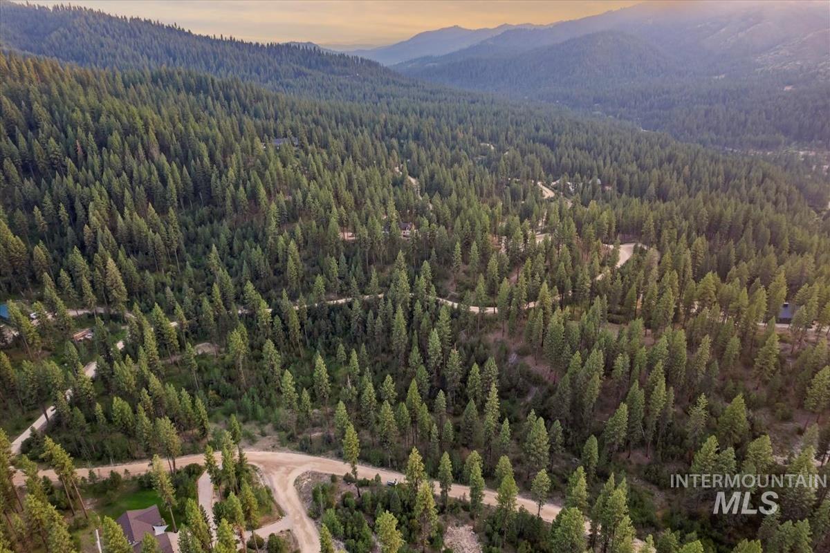 Lot 12 Shaw Gulch Road Boise, ID 83716 - Photo 12 of 23 Aerial view at dusk of a view of trees and a mountain view