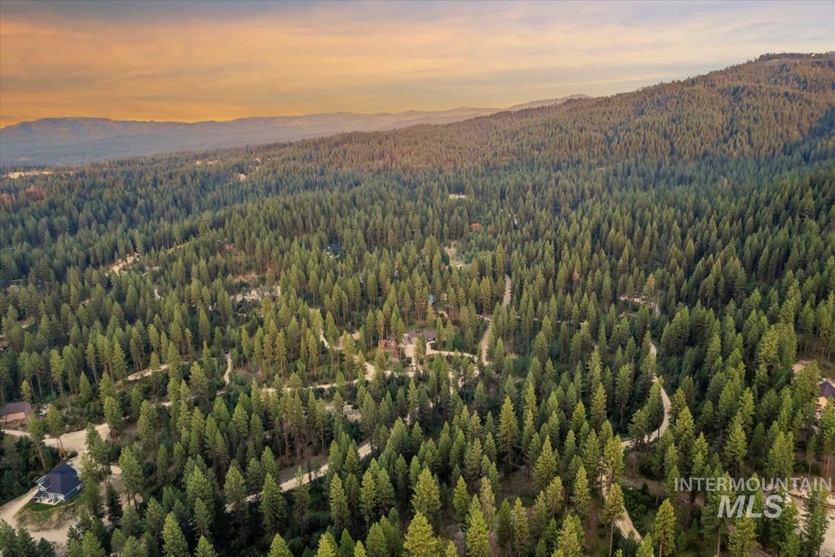 Lot 12 Shaw Gulch Road Boise, ID 83716 - Photo 16 of 23 Aerial view at dusk of a forest view and a mountain view