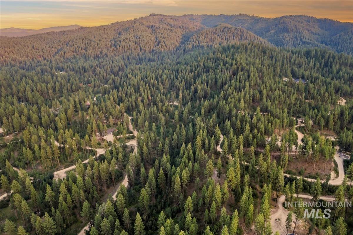 Lot 12 Shaw Gulch Road Boise, ID 83716 - Photo 10 of 23 Aerial view at dusk of a view of trees and a mountain view
