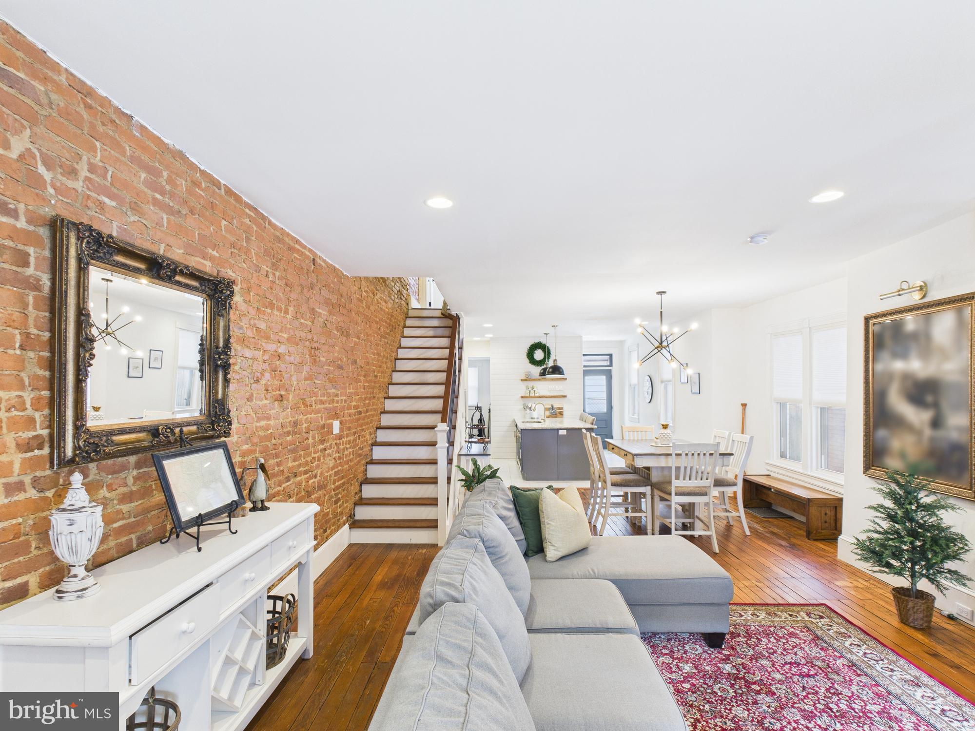305 West Lemon Street Lancaster, PA 17603 - Photo 6 of 31 Stunning Brick Wall In the Living & dining Rooms