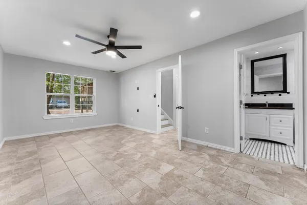 a view of an empty room with a window