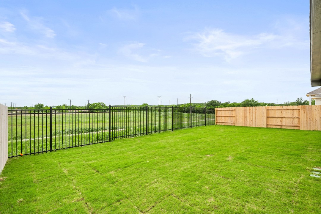 16201 Smithers Road Manor, TX 78653 - Photo 39 of 40 a view of a field with a fence