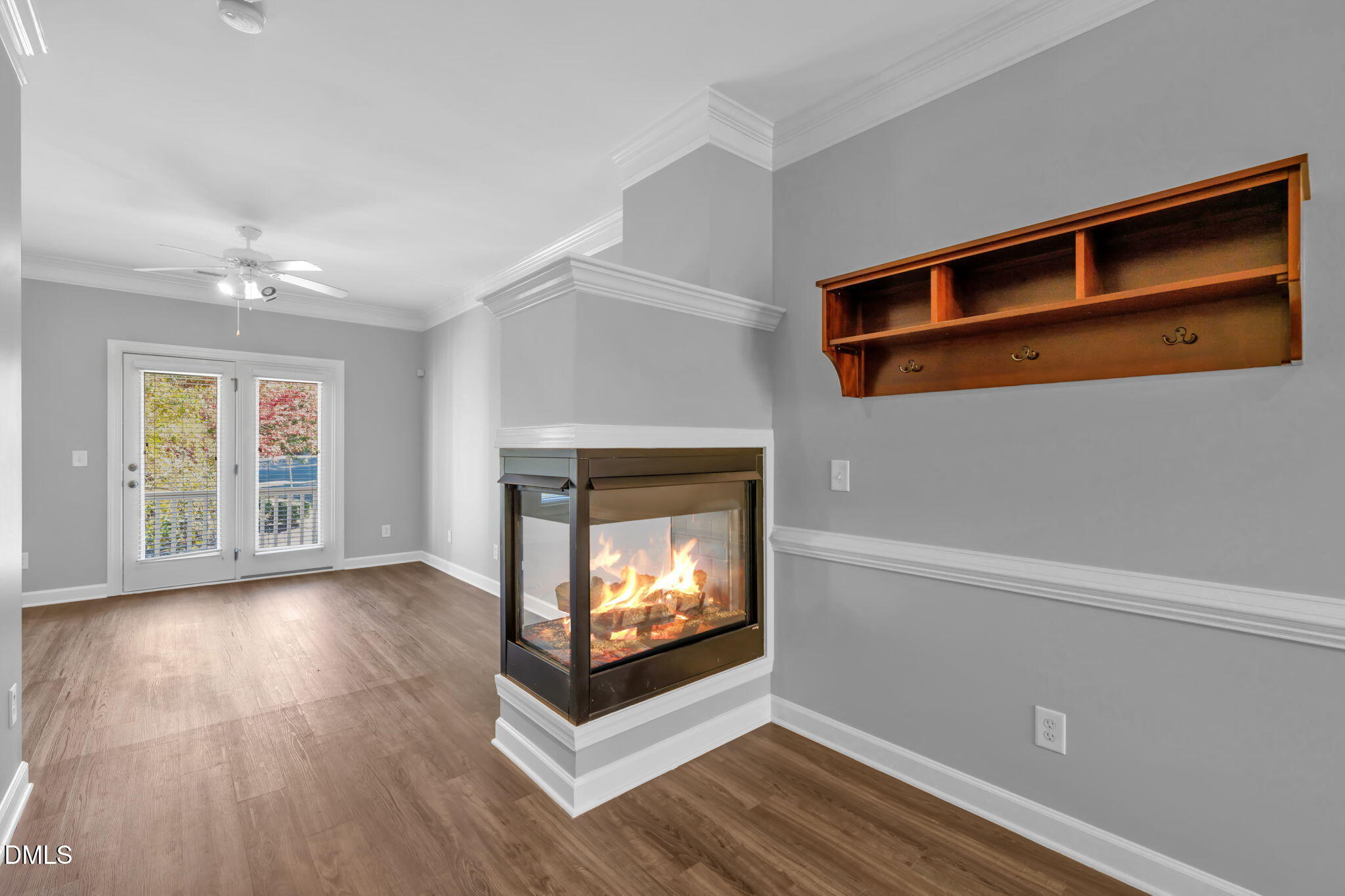 8005 Sycamore Hill Lane Raleigh, NC 27612 - Photo 16 of 31 a view of an empty room with wooden floor fireplace and a window