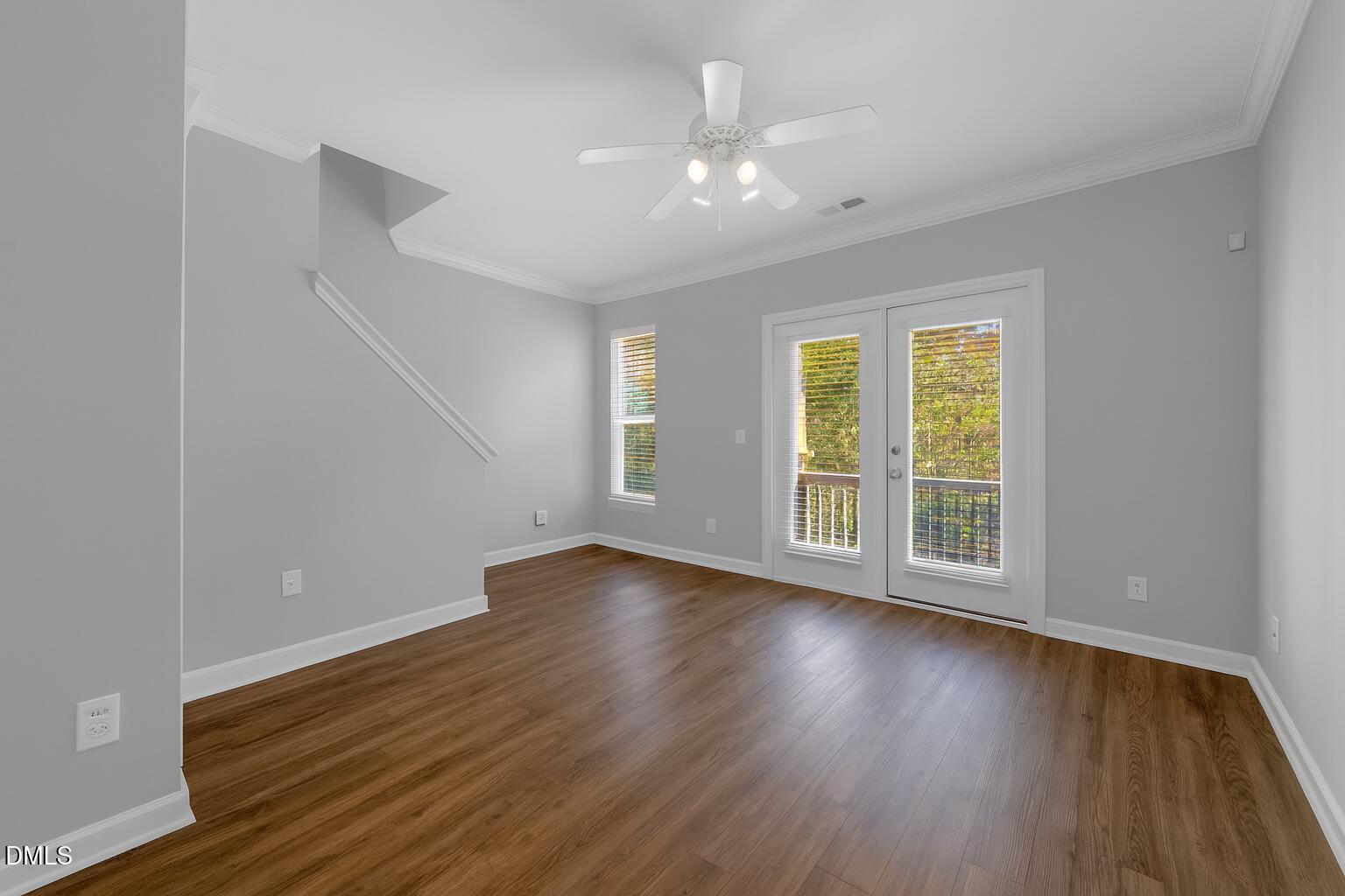 8005 Sycamore Hill Lane Raleigh, NC 27612 - Photo 17 of 31 a view of an empty room with wooden floor and a window