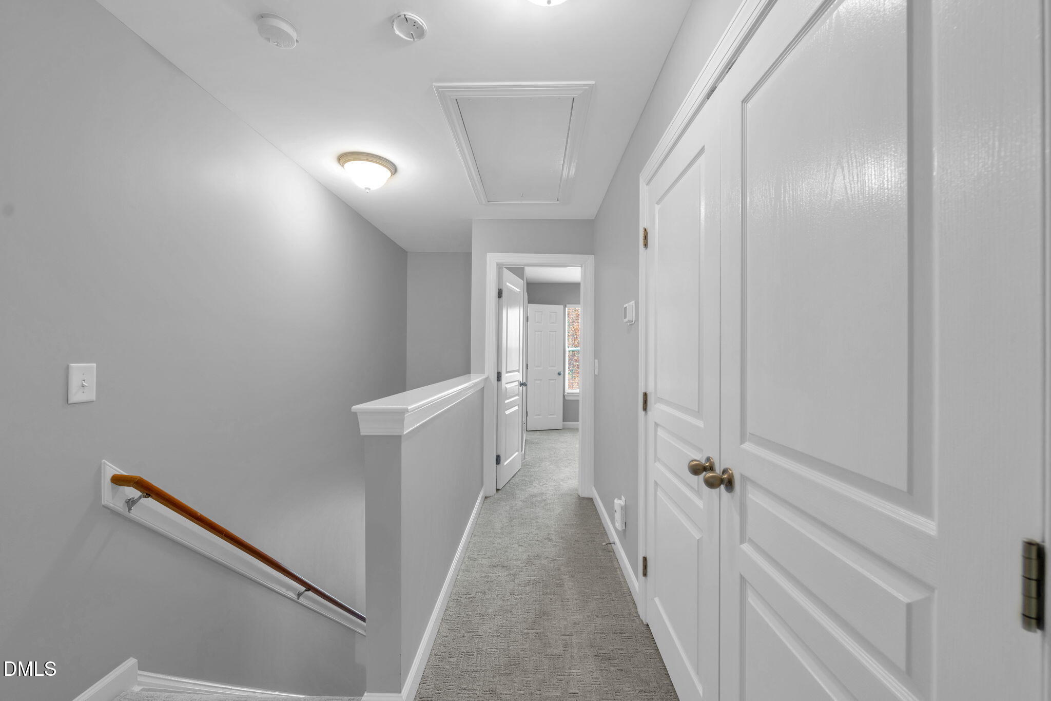 8005 Sycamore Hill Lane Raleigh, NC 27612 - Photo 20 of 31 a view of a hallway with white walls