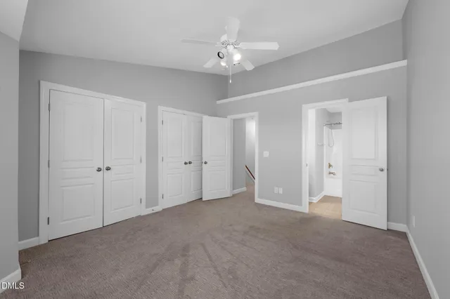 a bathroom with a granite countertop sink mirror toilet and bathtub