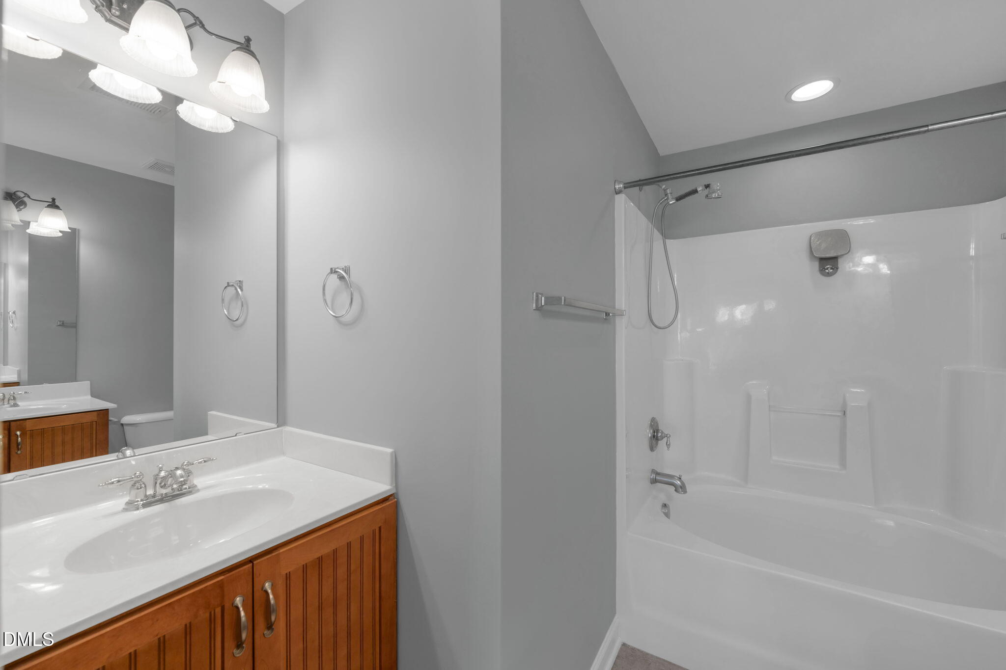 8005 Sycamore Hill Lane Raleigh, NC 27612 - Photo 25 of 31 a bathroom with a sink a toilet and shower
