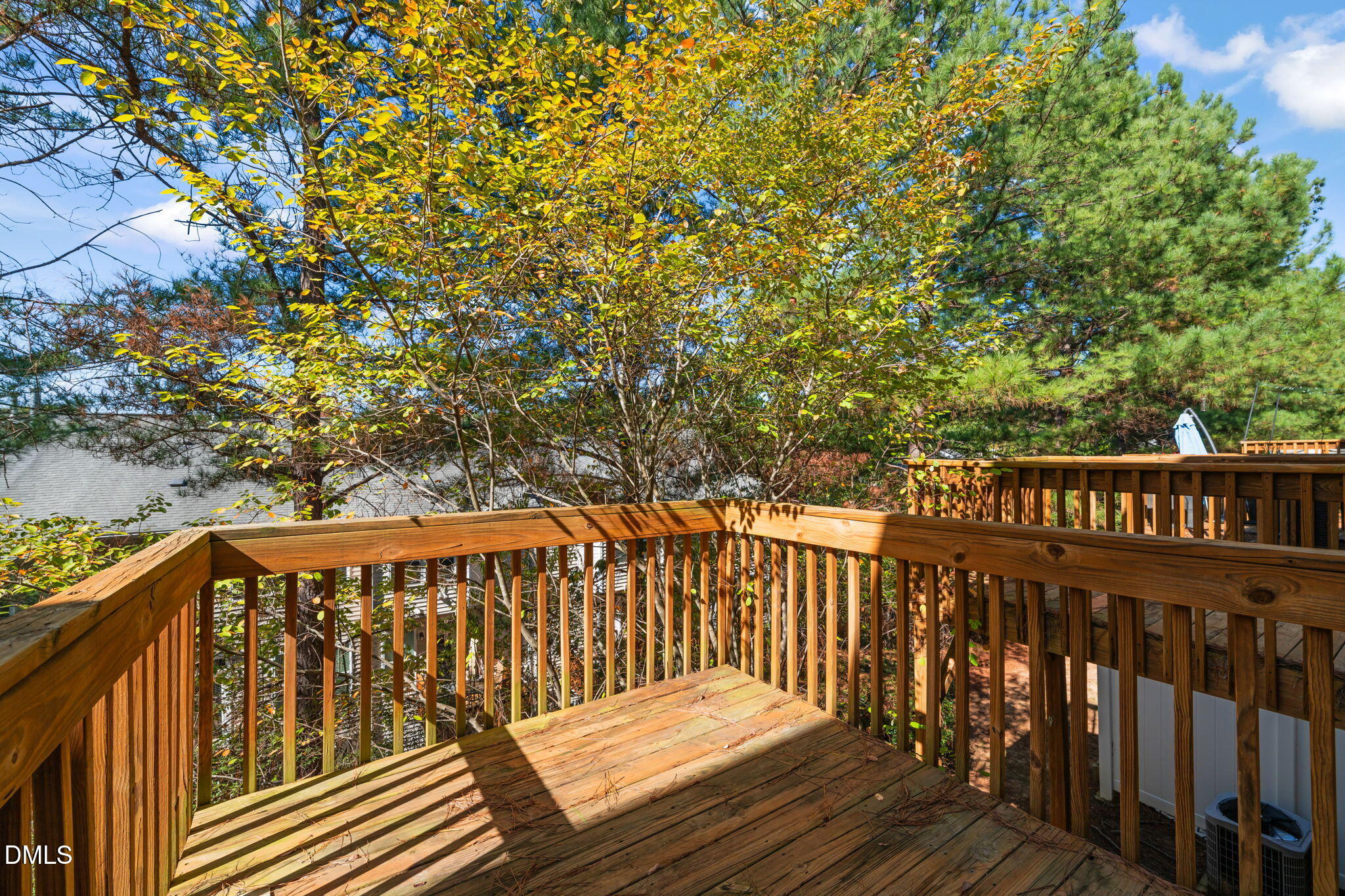 8005 Sycamore Hill Lane Raleigh, NC 27612 - Photo 4 of 31 a balcony with wooden floor and fence