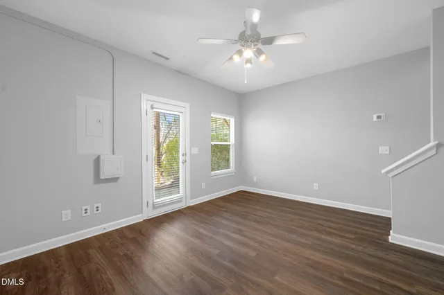 wooden floor in an empty room with a window