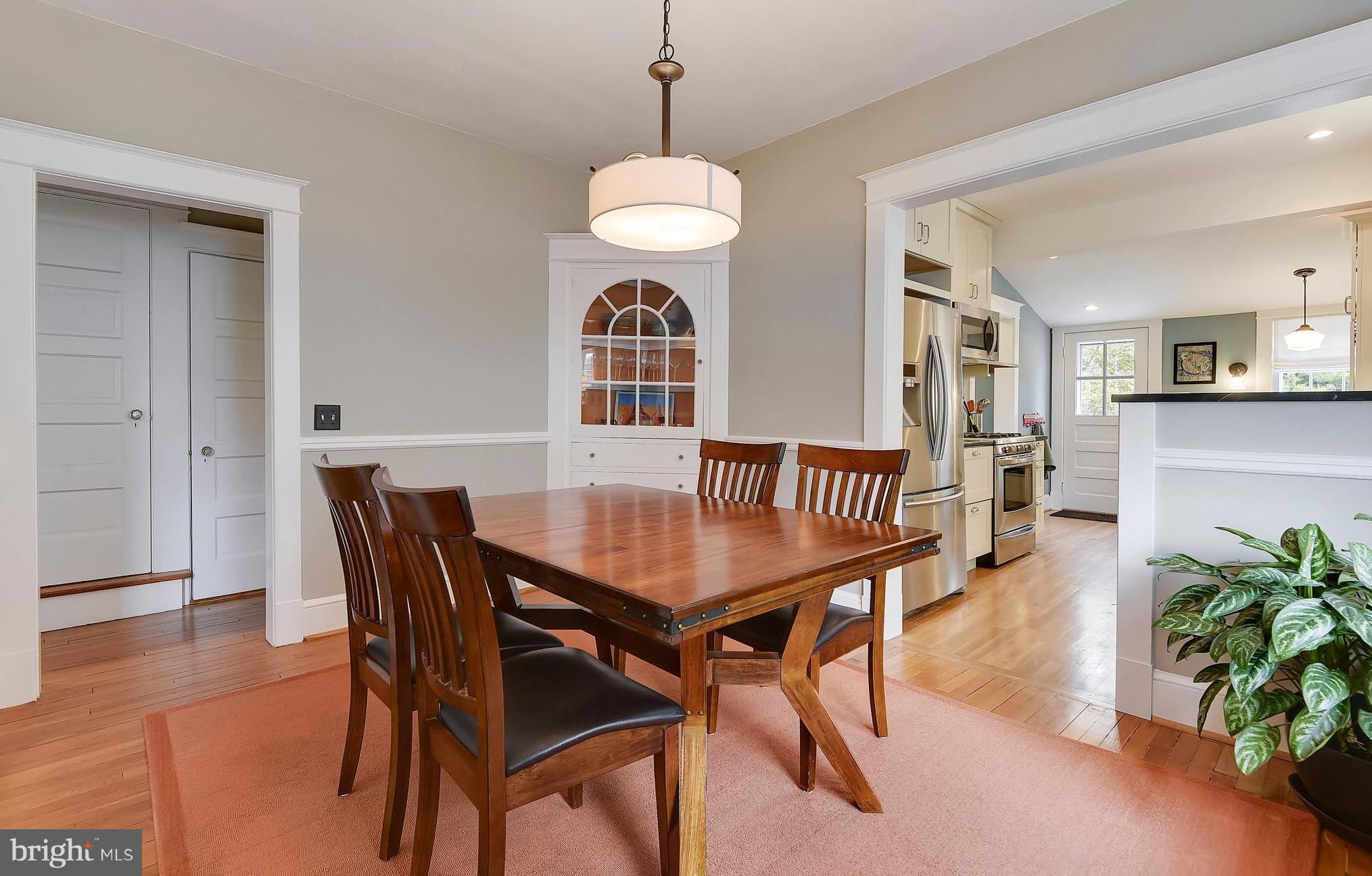 1919 Glen Ross Road Silver Spring, MD 20910 - Photo 12 of 39 a view of a dining room with furniture and wooden floor