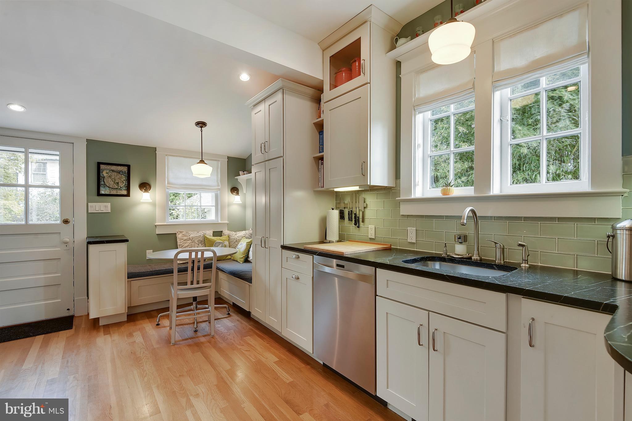1919 Glen Ross Road Silver Spring, MD 20910 - Photo 15 of 39 a kitchen with sink cabinets and wooden floor