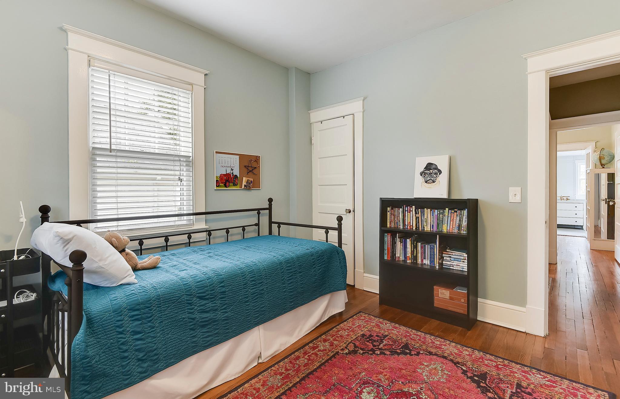 1919 Glen Ross Road Silver Spring, MD 20910 - Photo 24 of 39 a bedroom with furniture and a window