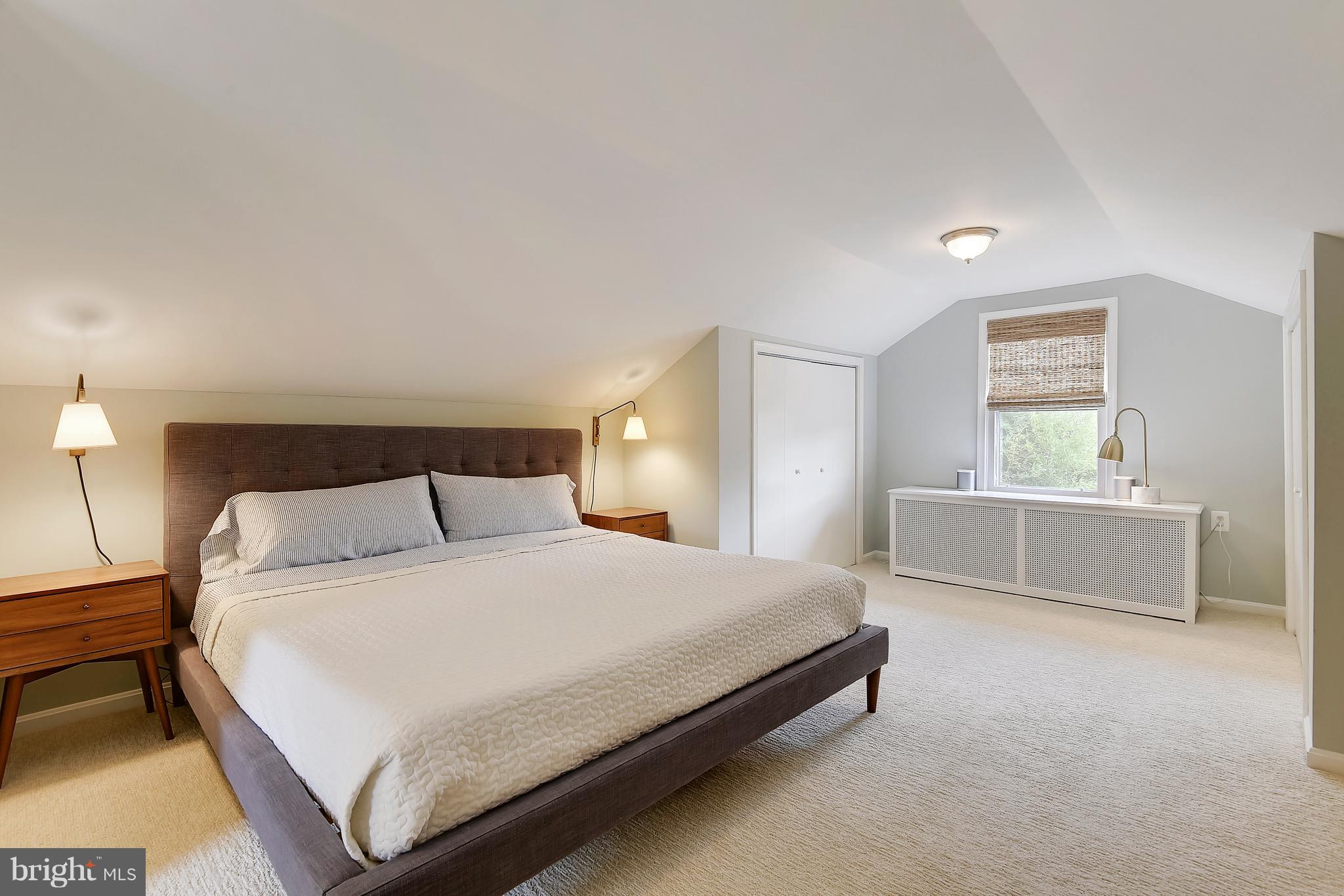 1919 Glen Ross Road Silver Spring, MD 20910 - Photo 27 of 39 a bedroom with a bed and a night stand