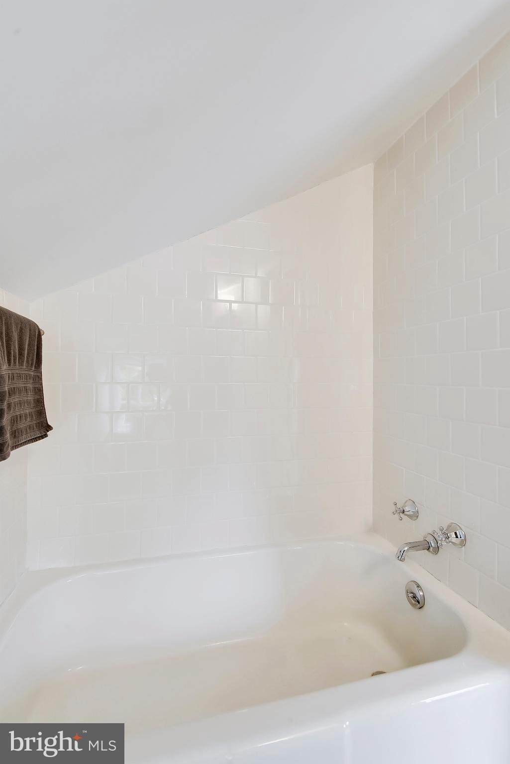 1919 Glen Ross Road Silver Spring, MD 20910 - Photo 31 of 39 a bathroom with a bathtub