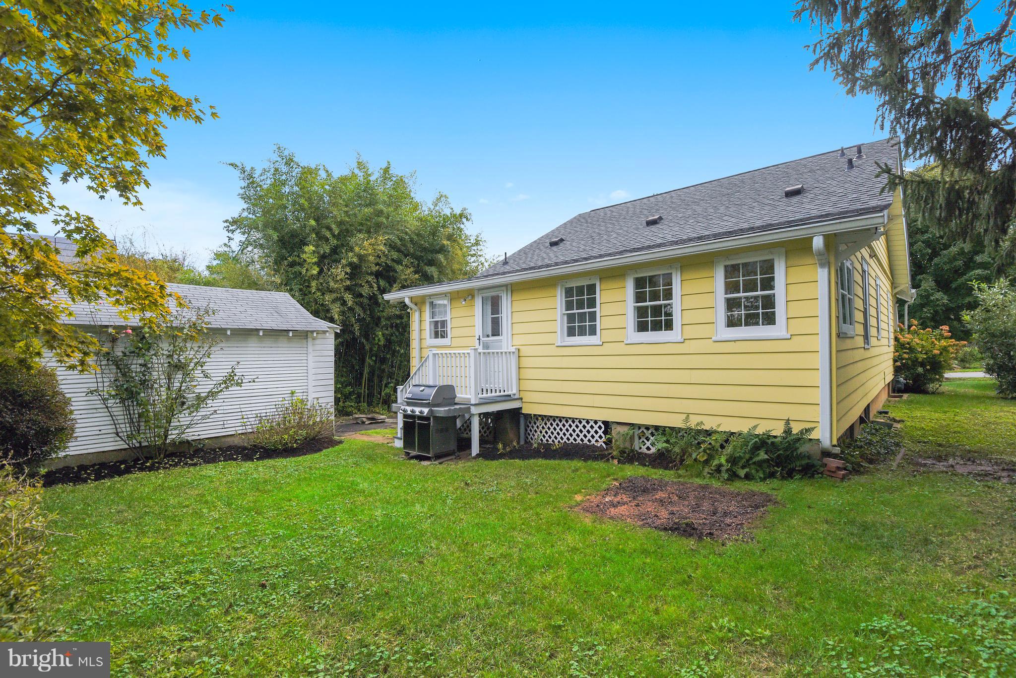 1919 Glen Ross Road Silver Spring, MD 20910 - Photo 35 of 39 a backyard of a house with table and chairs