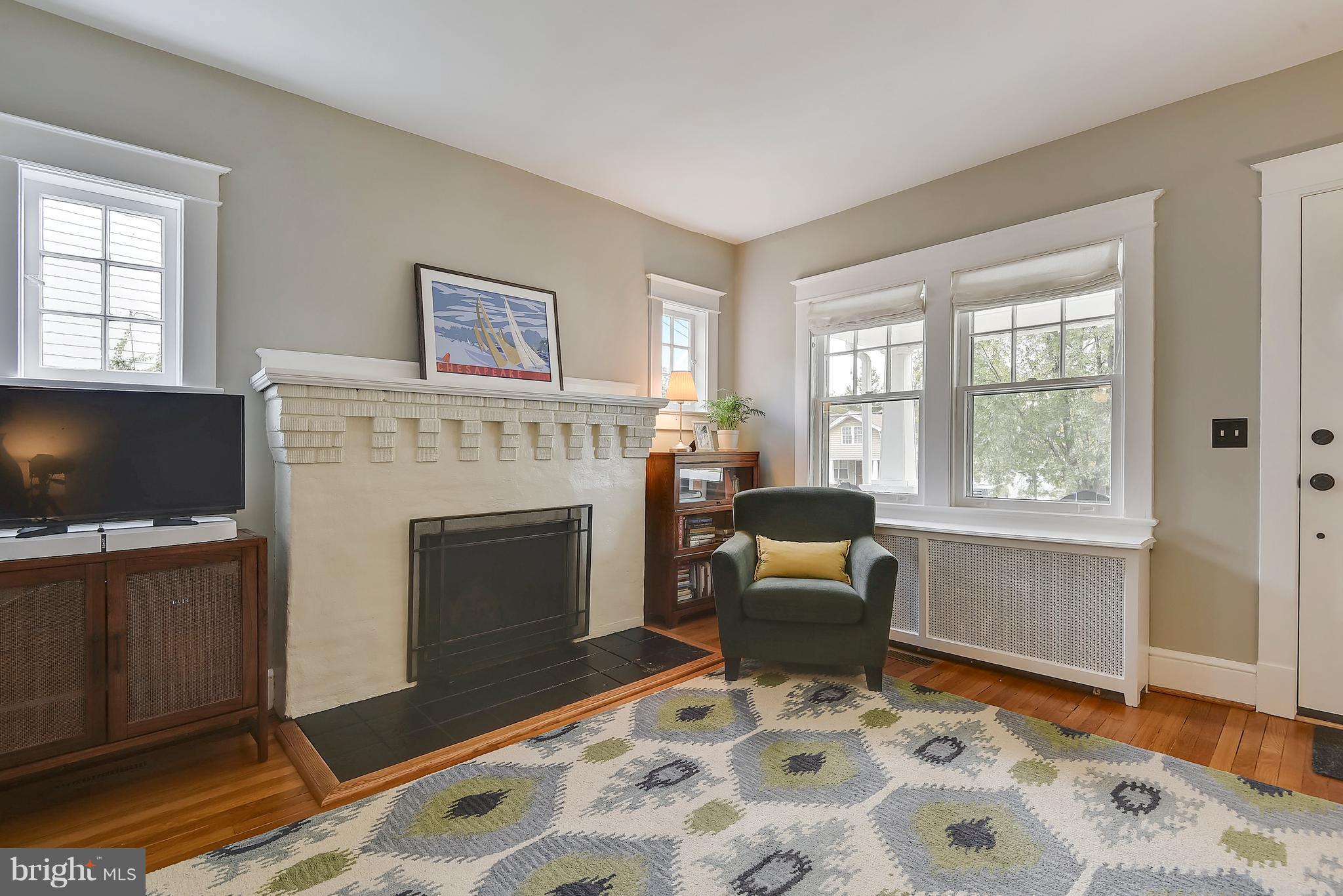 1919 Glen Ross Road Silver Spring, MD 20910 - Photo 7 of 39 a living room with furniture and a fireplace