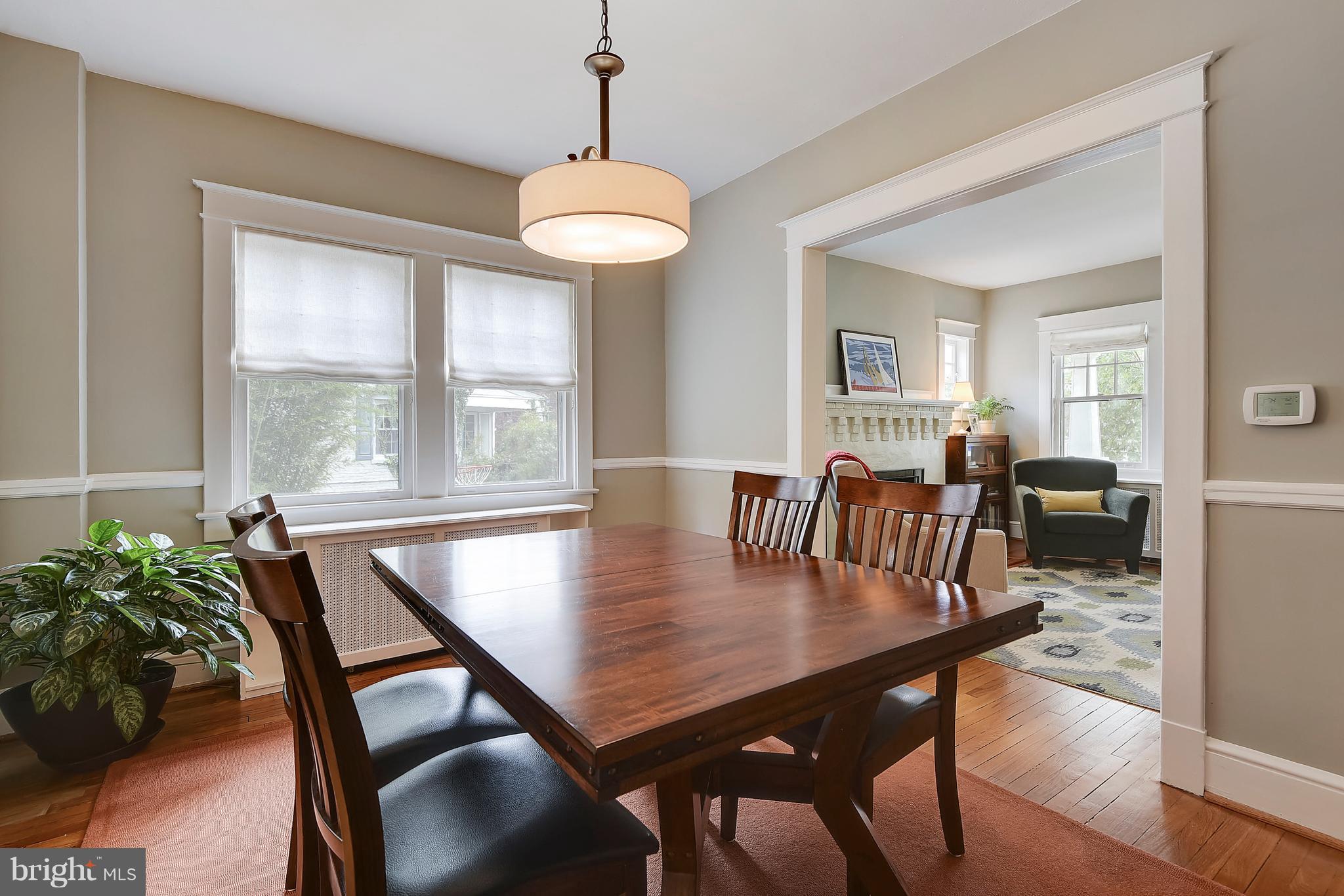 1919 Glen Ross Road Silver Spring, MD 20910 - Photo 10 of 39 a view of a dining room with furniture window and wooden floor