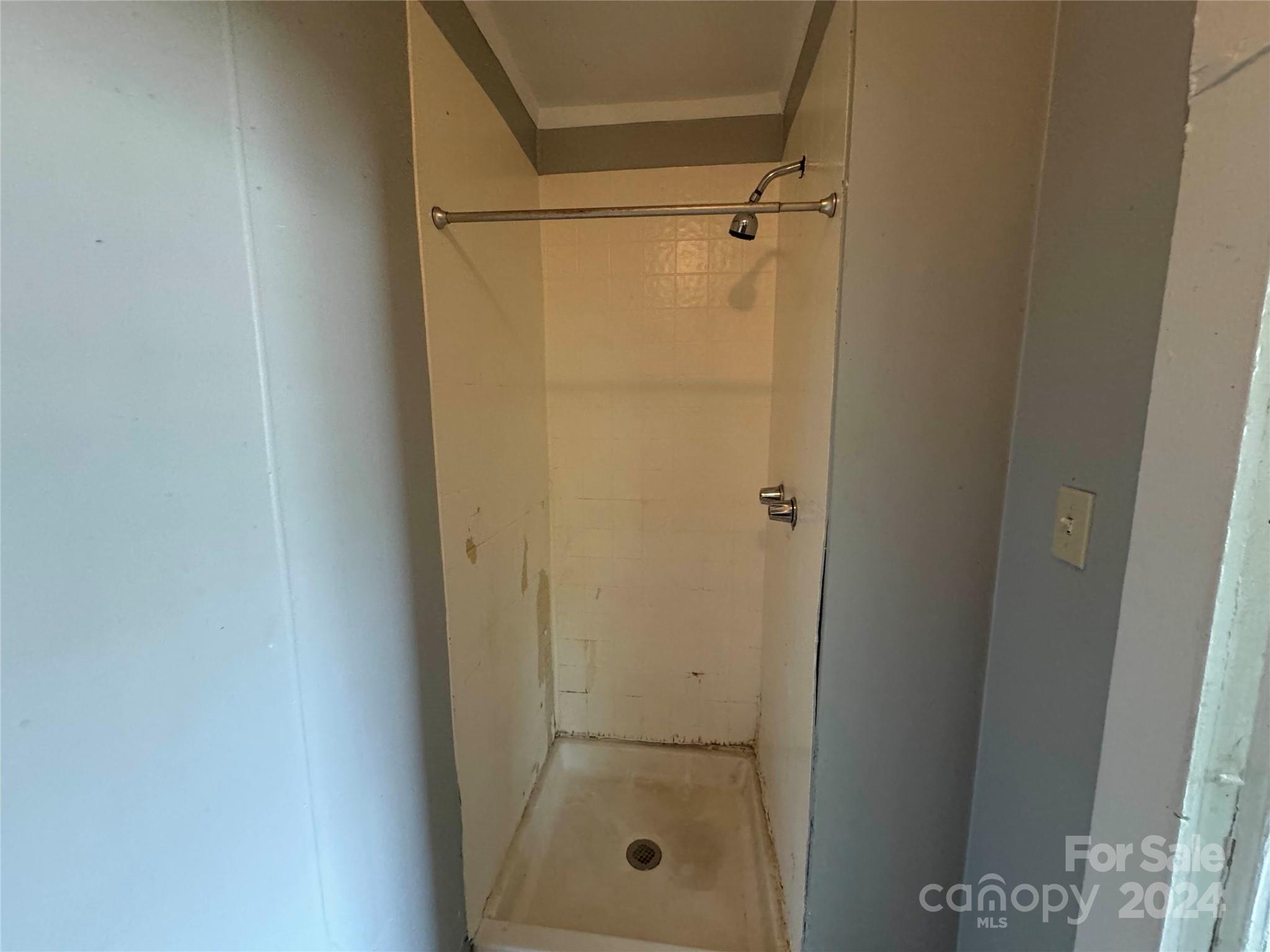 1120 North Ransom Street Gastonia, NC 28052 - Photo 13 of 16 a bathroom with a glass shower door