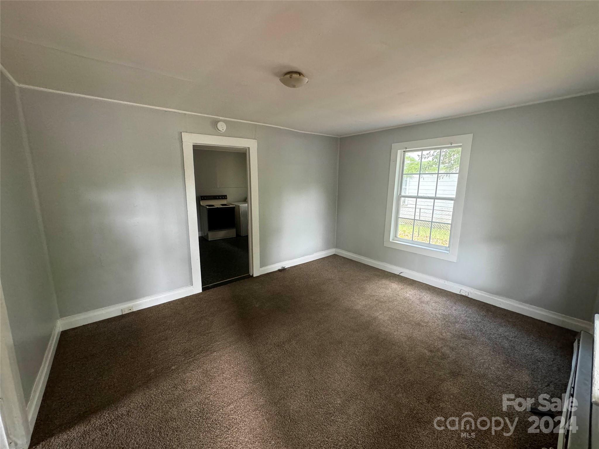 1120 North Ransom Street Gastonia, NC 28052 - Photo 2 of 16 an empty room with windows