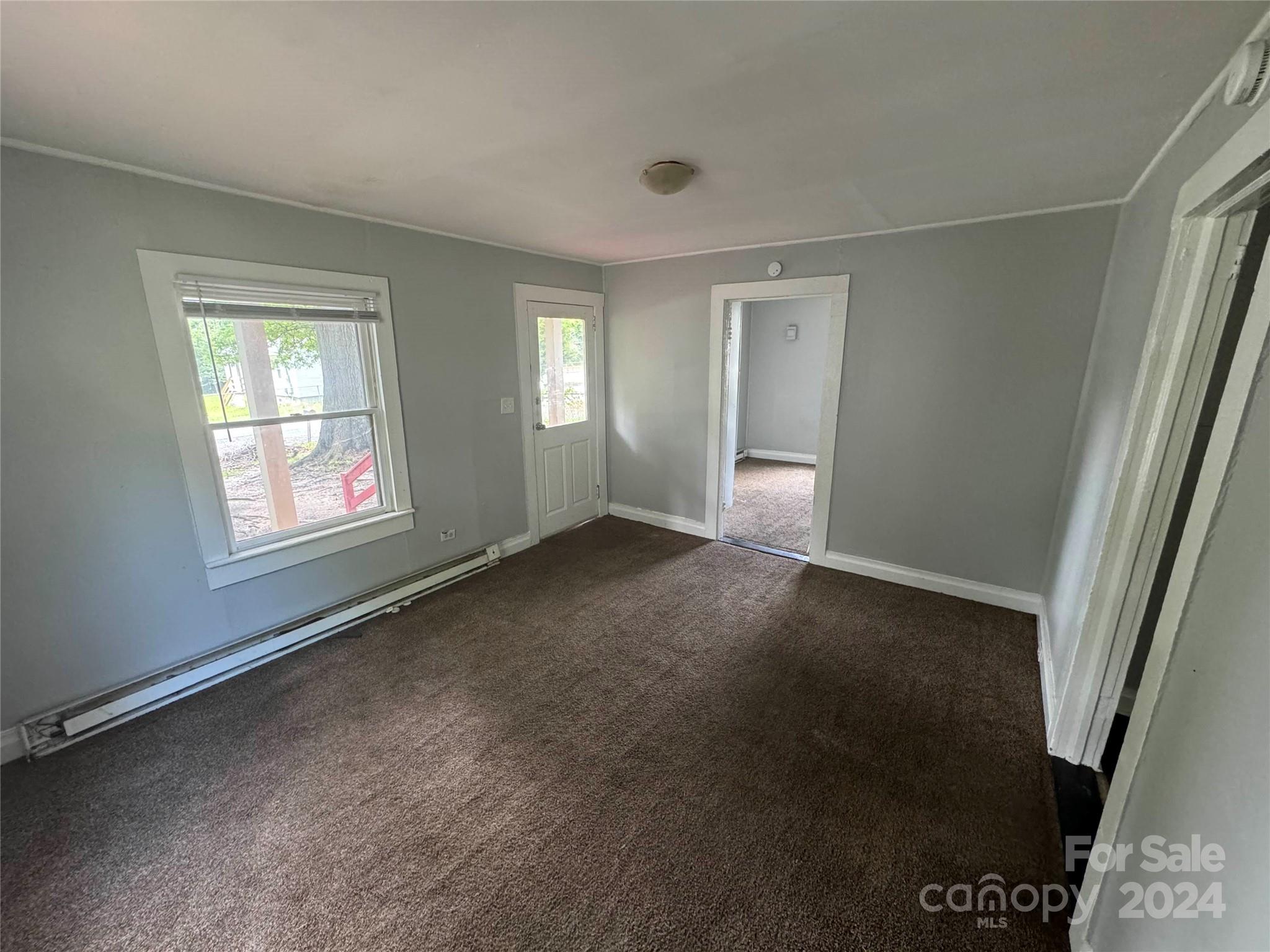 1120 North Ransom Street Gastonia, NC 28052 - Photo 3 of 16 a view of an empty room with a window