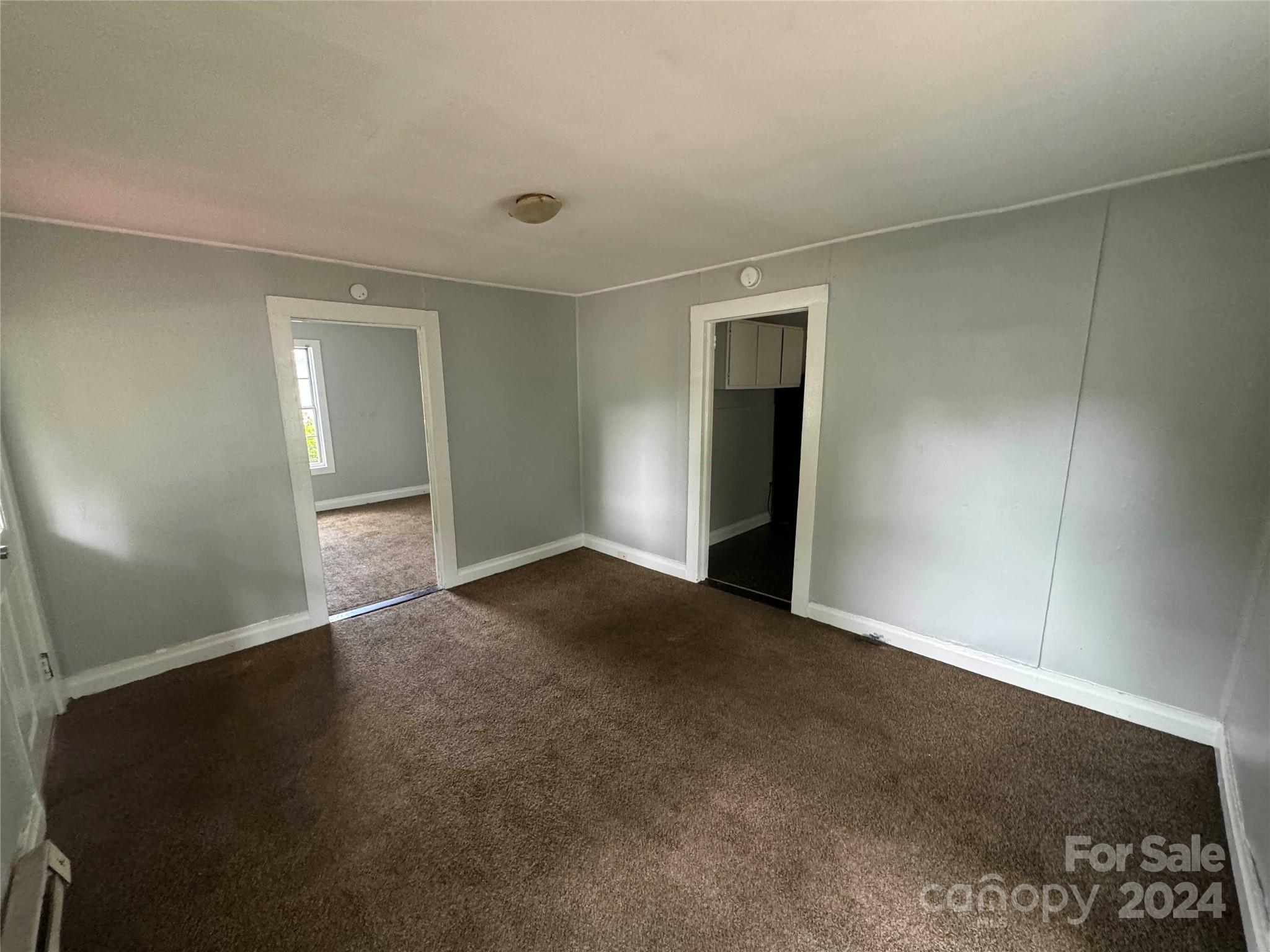 1120 North Ransom Street Gastonia, NC 28052 - Photo 4 of 16 an empty room with windows
