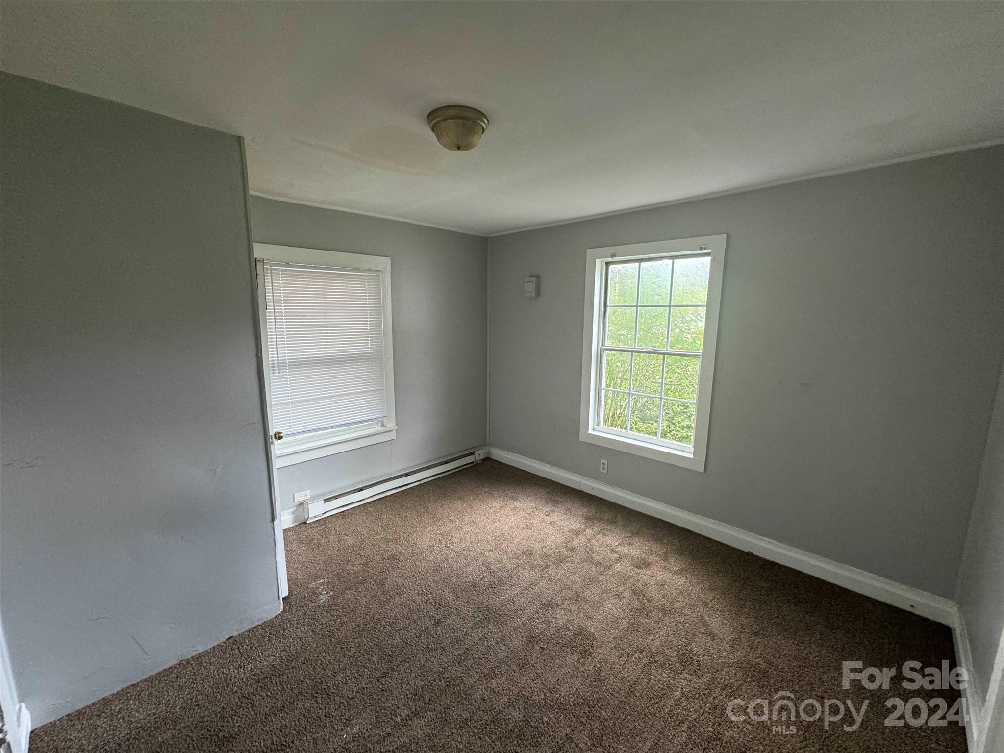 1120 North Ransom Street Gastonia, NC 28052 - Photo 5 of 16 an empty room with windows