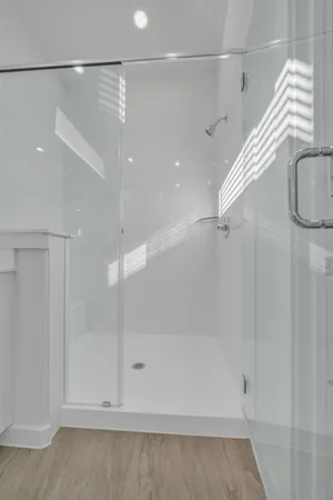 a bathroom with a shower and a shower