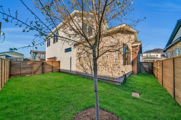 a backyard of a house with lots of green space