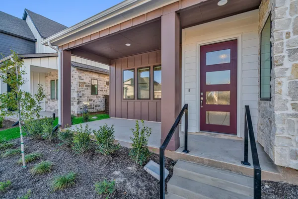 a view of front door of house with stairs